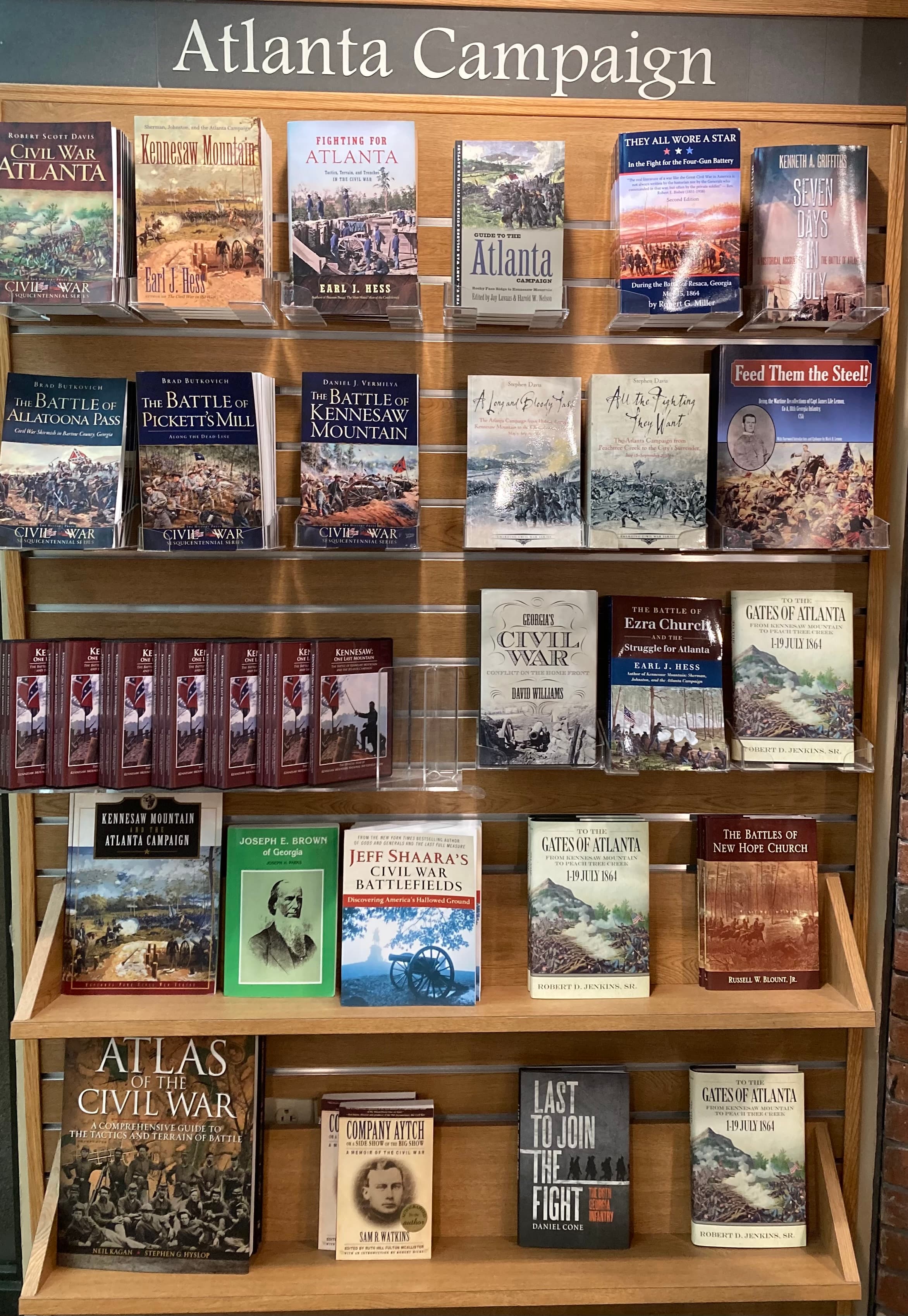 Wooden shelves stacked high with books on the subject of the Atlanta Campaign