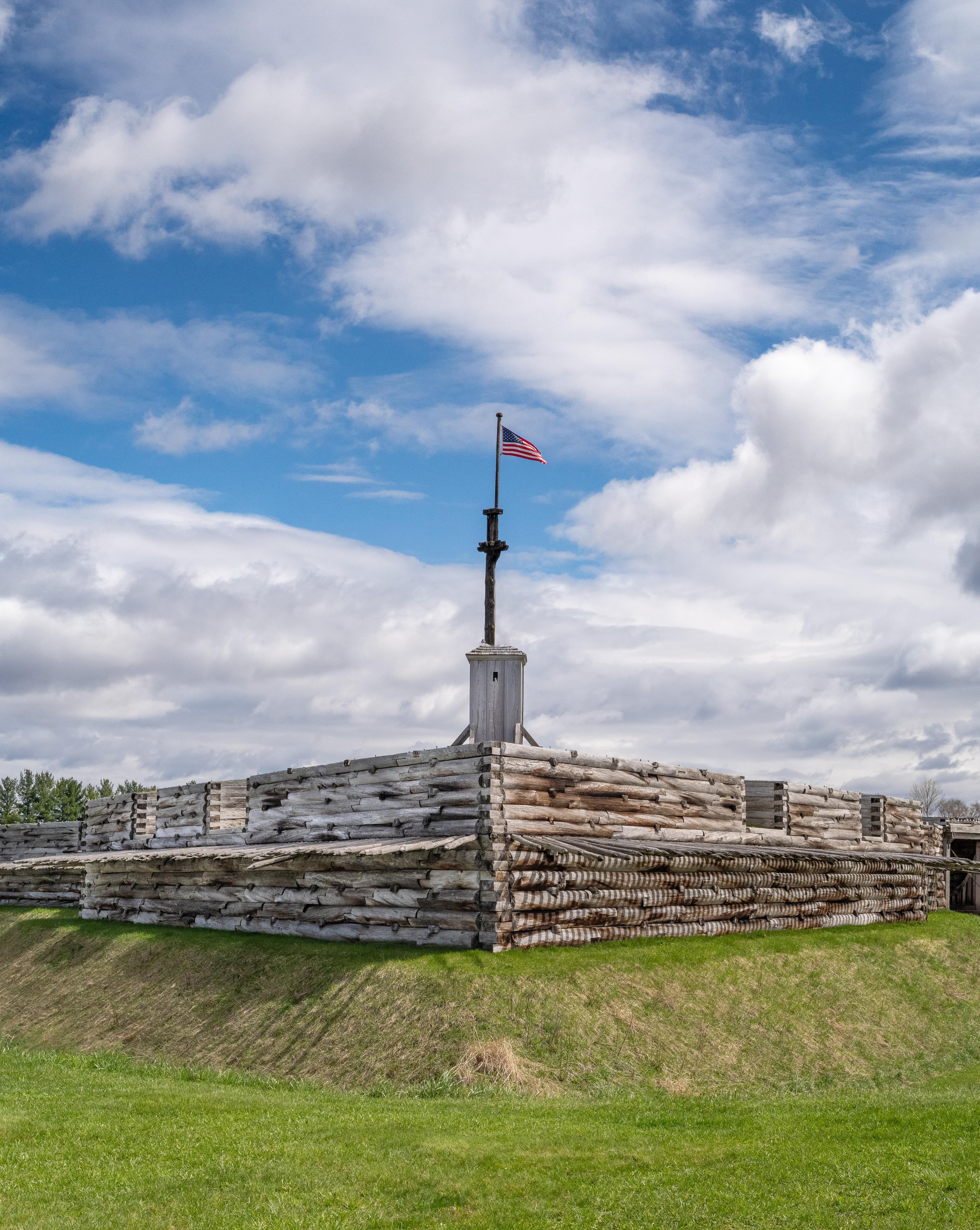 A view of the fort flagpole from outside. The fort almost looks like a big wooden ship under it.