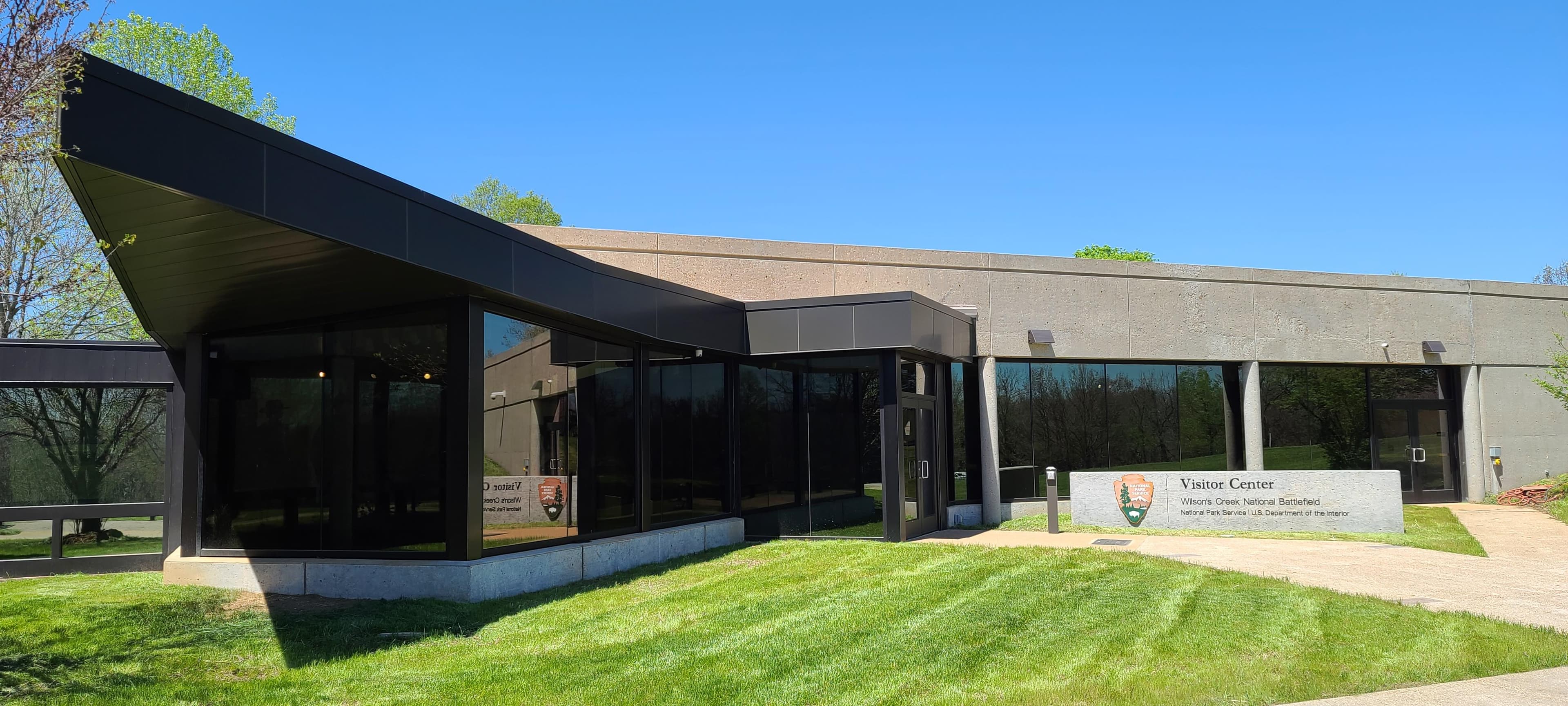 Visitor Center building main entrance with sunny blue sky background