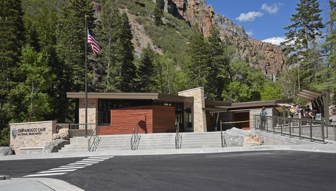 Visitor center in front of a mountain backdrop