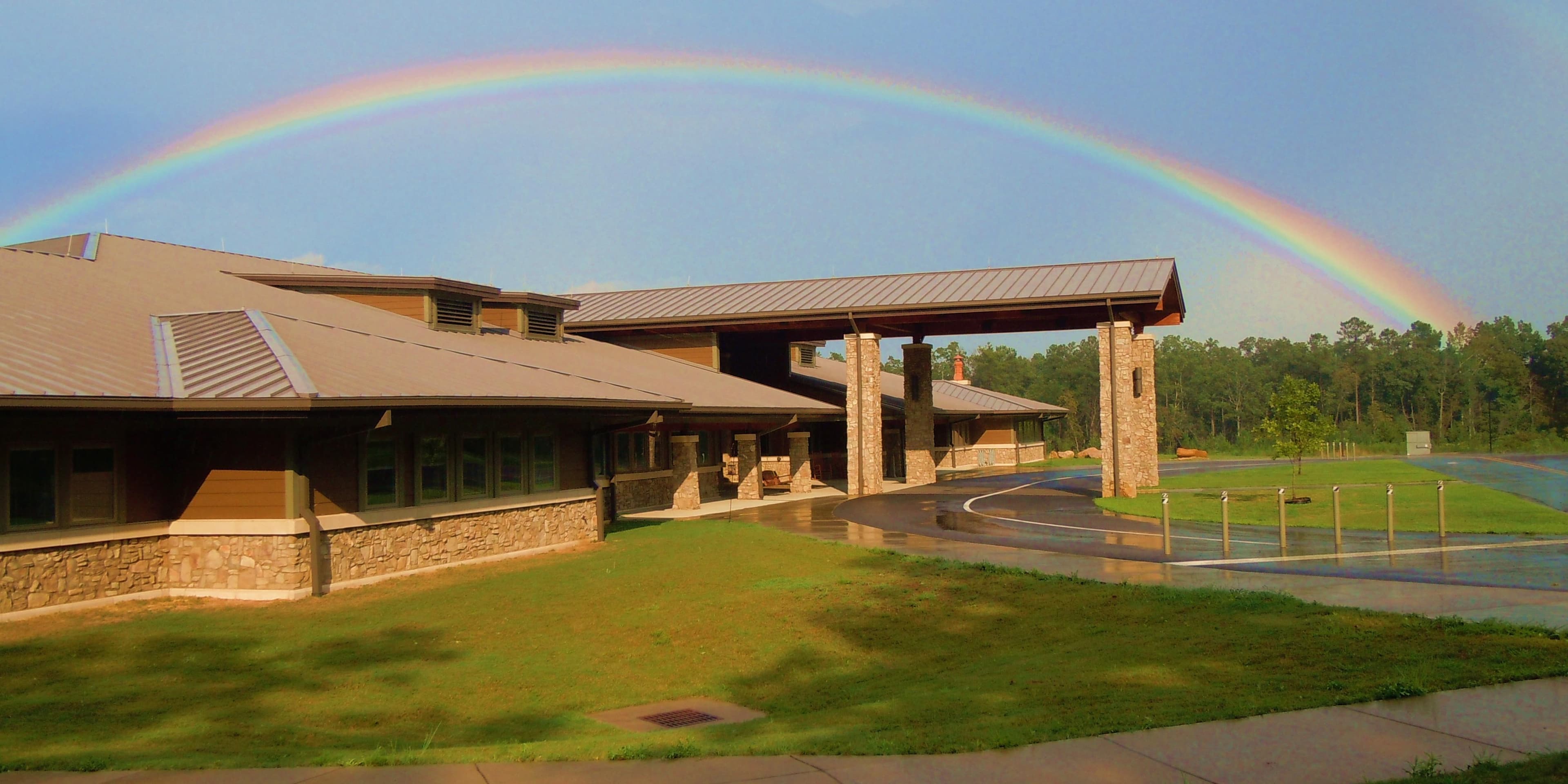 Jacksonville State University Little River Canyon Center with a rainbow spanning the building.