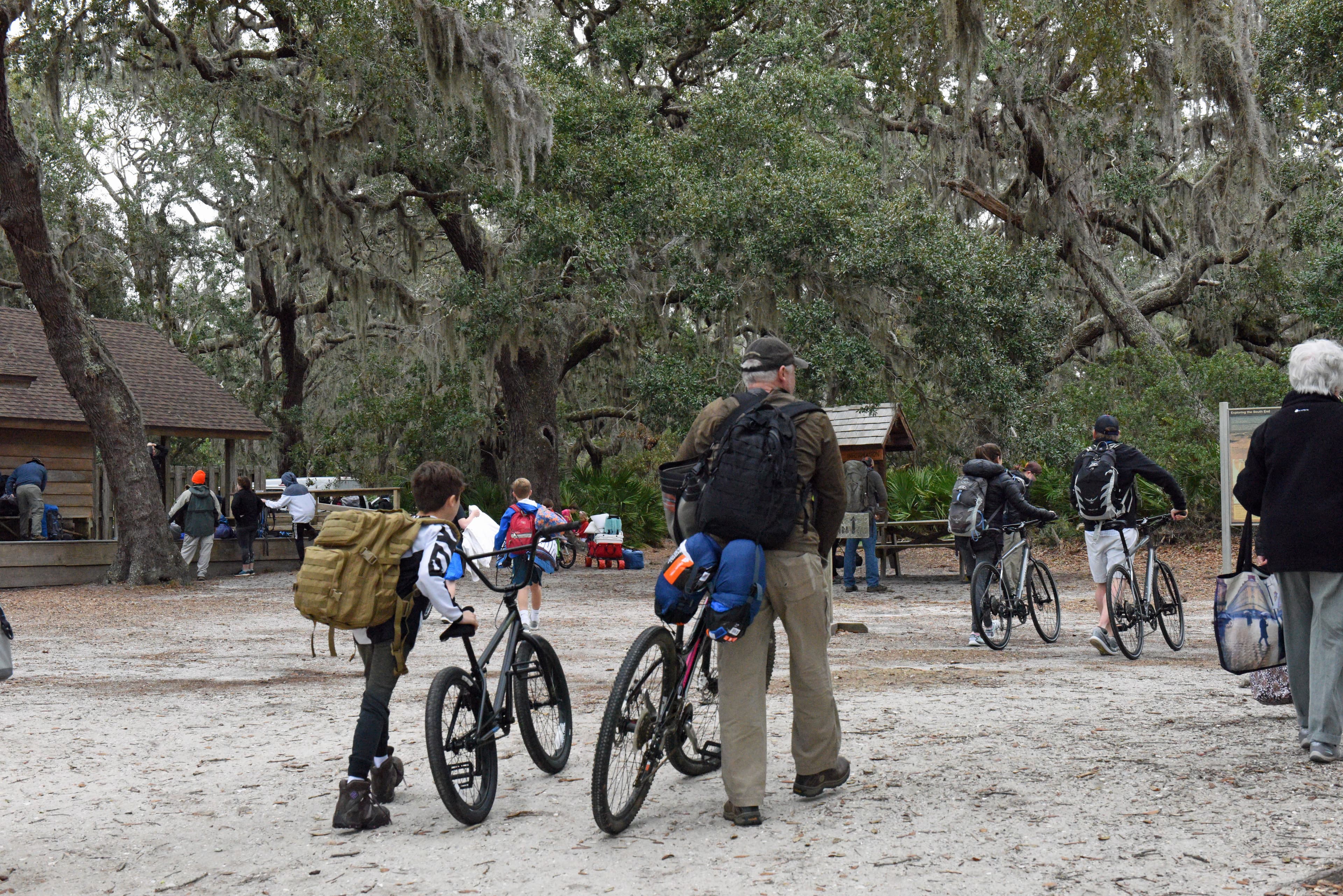 Visitors pushing thier bikes onto the island