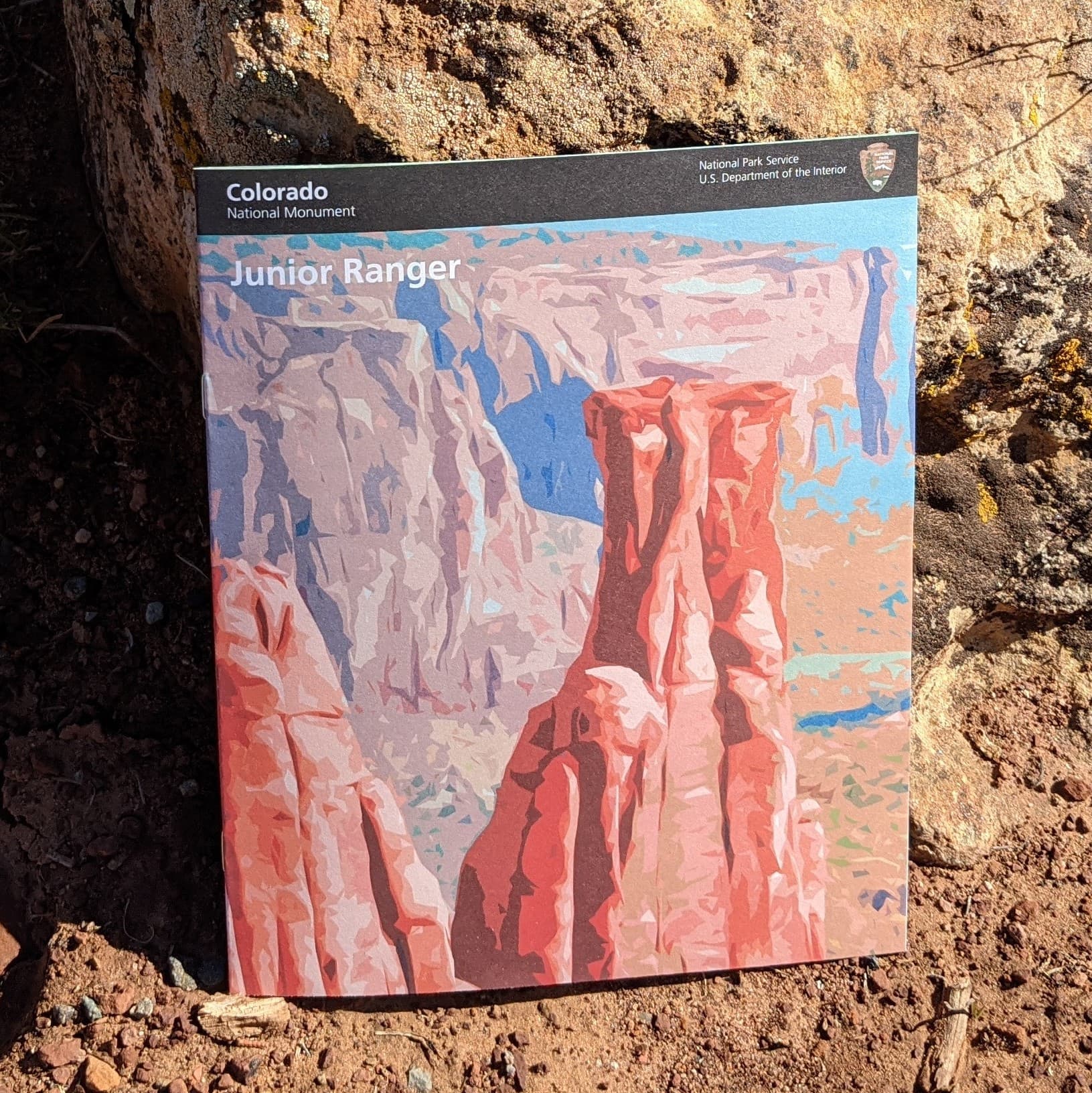 colorful booklet with illustrations of canyon sandstone towers