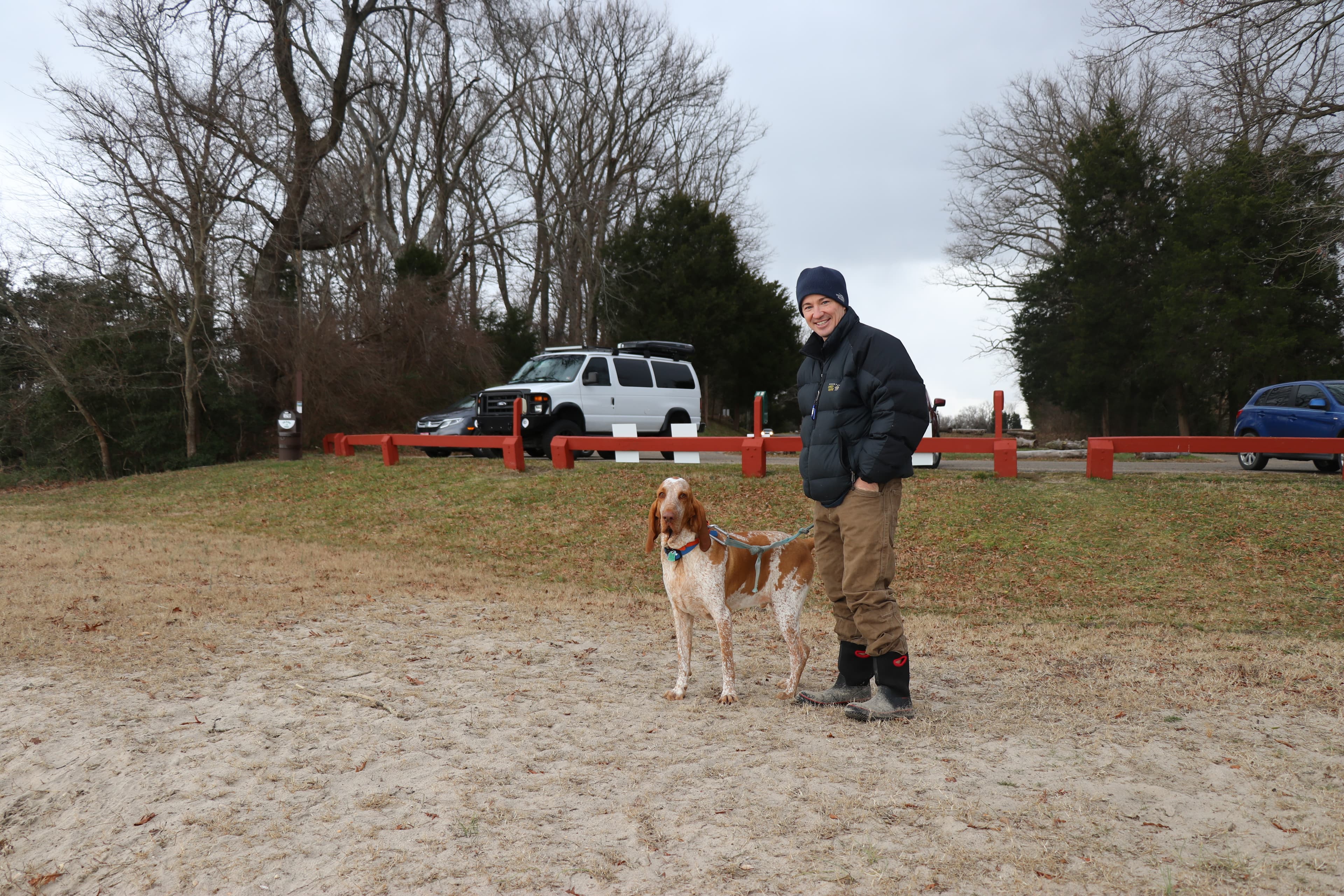 person standing with dog on leash