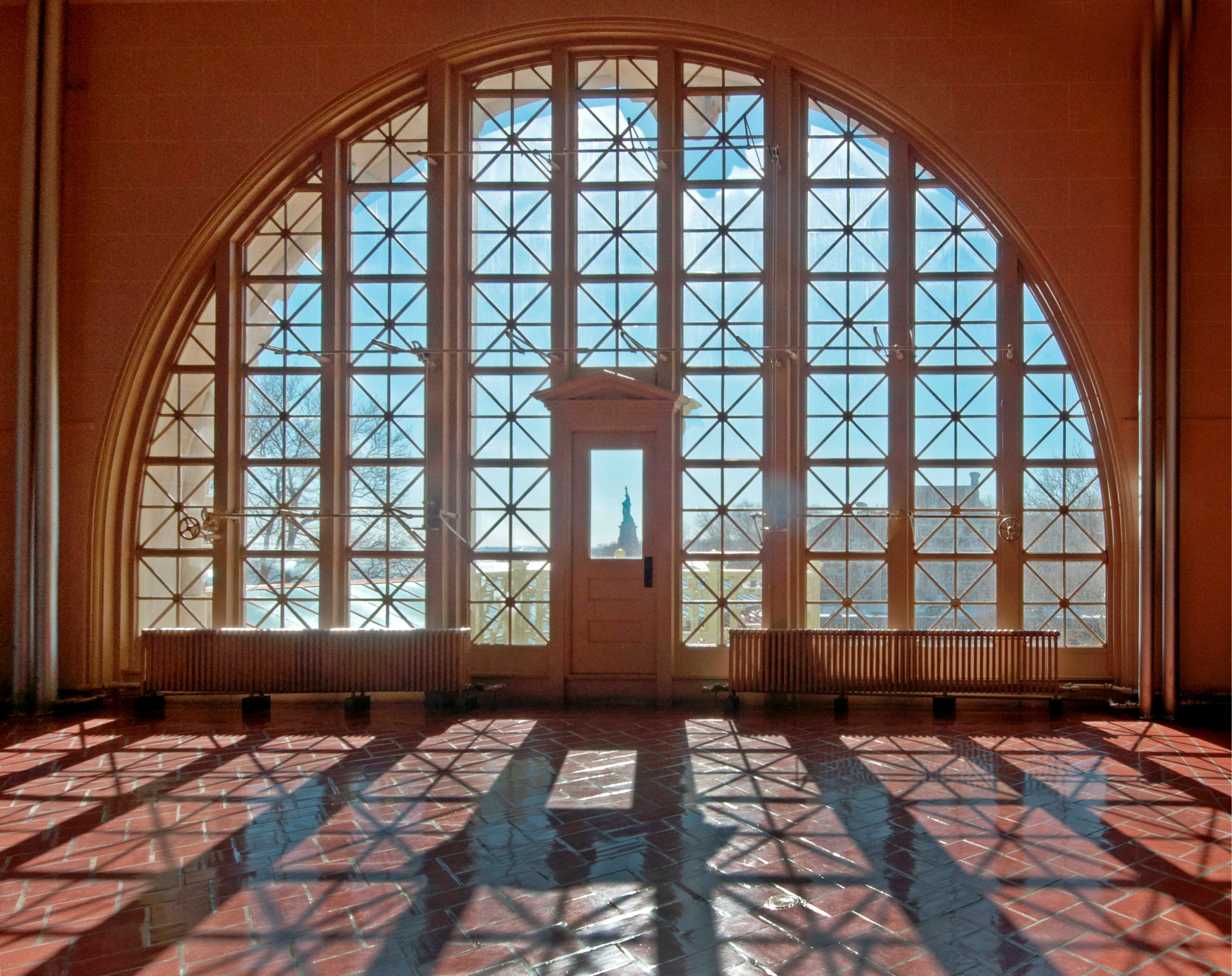 Windows on second floor great wall showing Liberty through the door window.