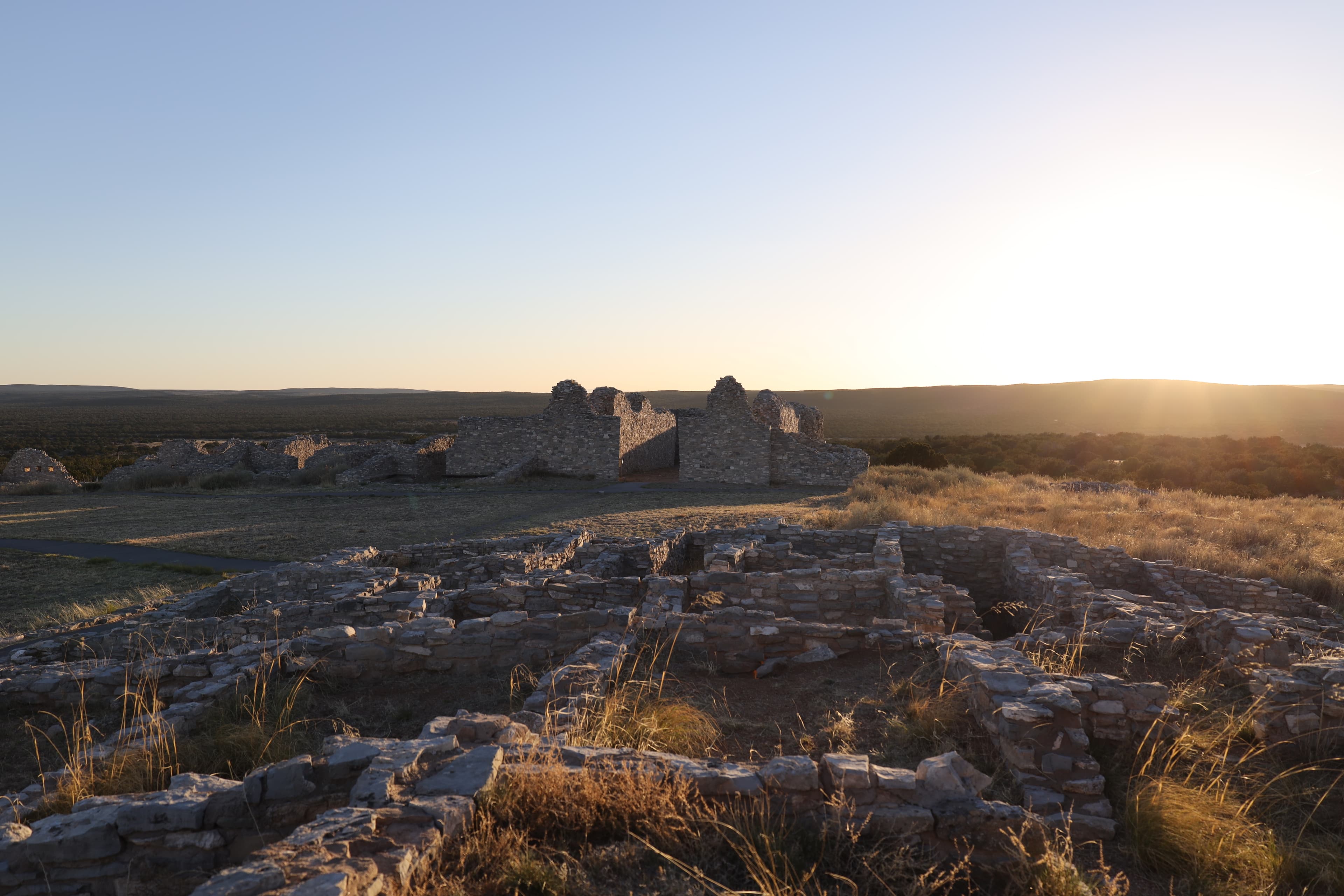 Grey limestone church and pueblo ruins