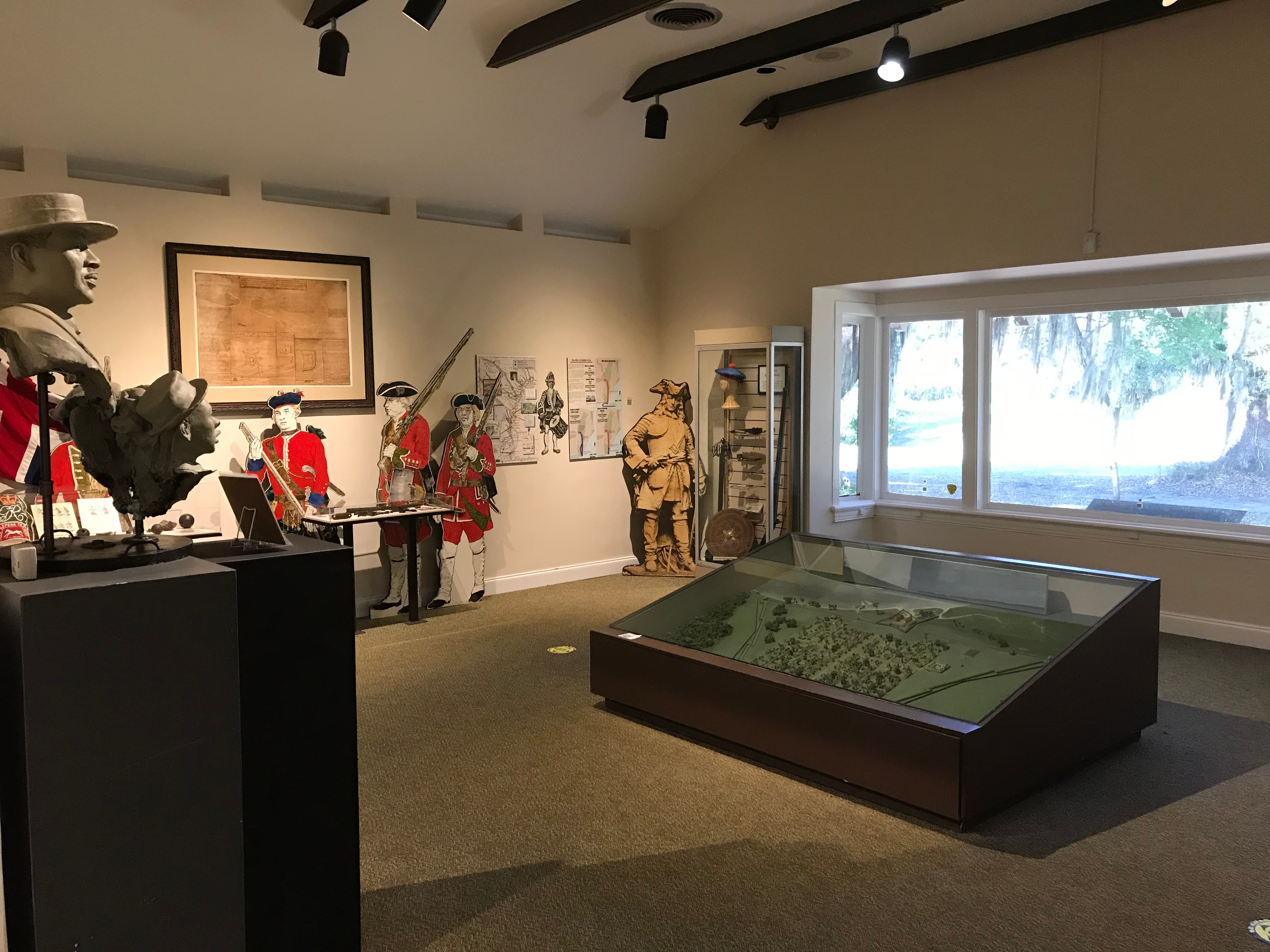 Museum exhibit area with information panels and large window