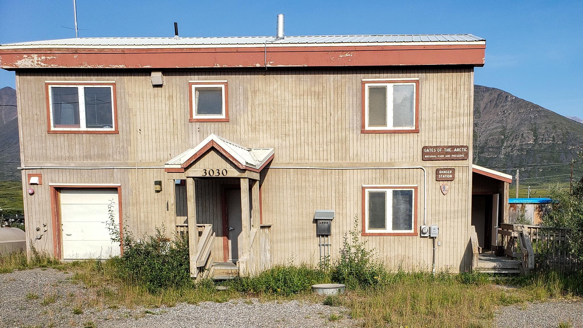 view of 2 story tan building