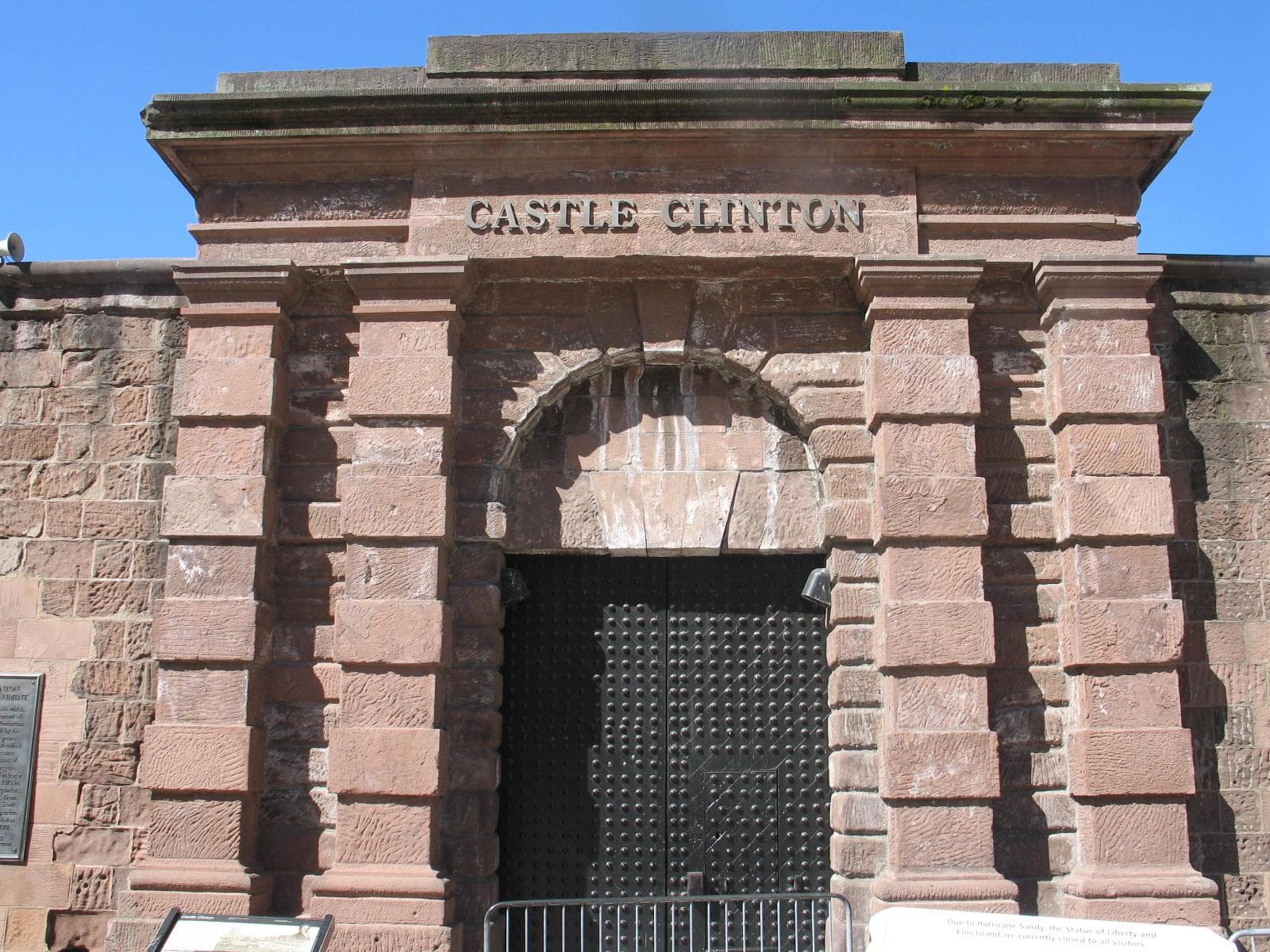 Arch entrance to a brown stone fort