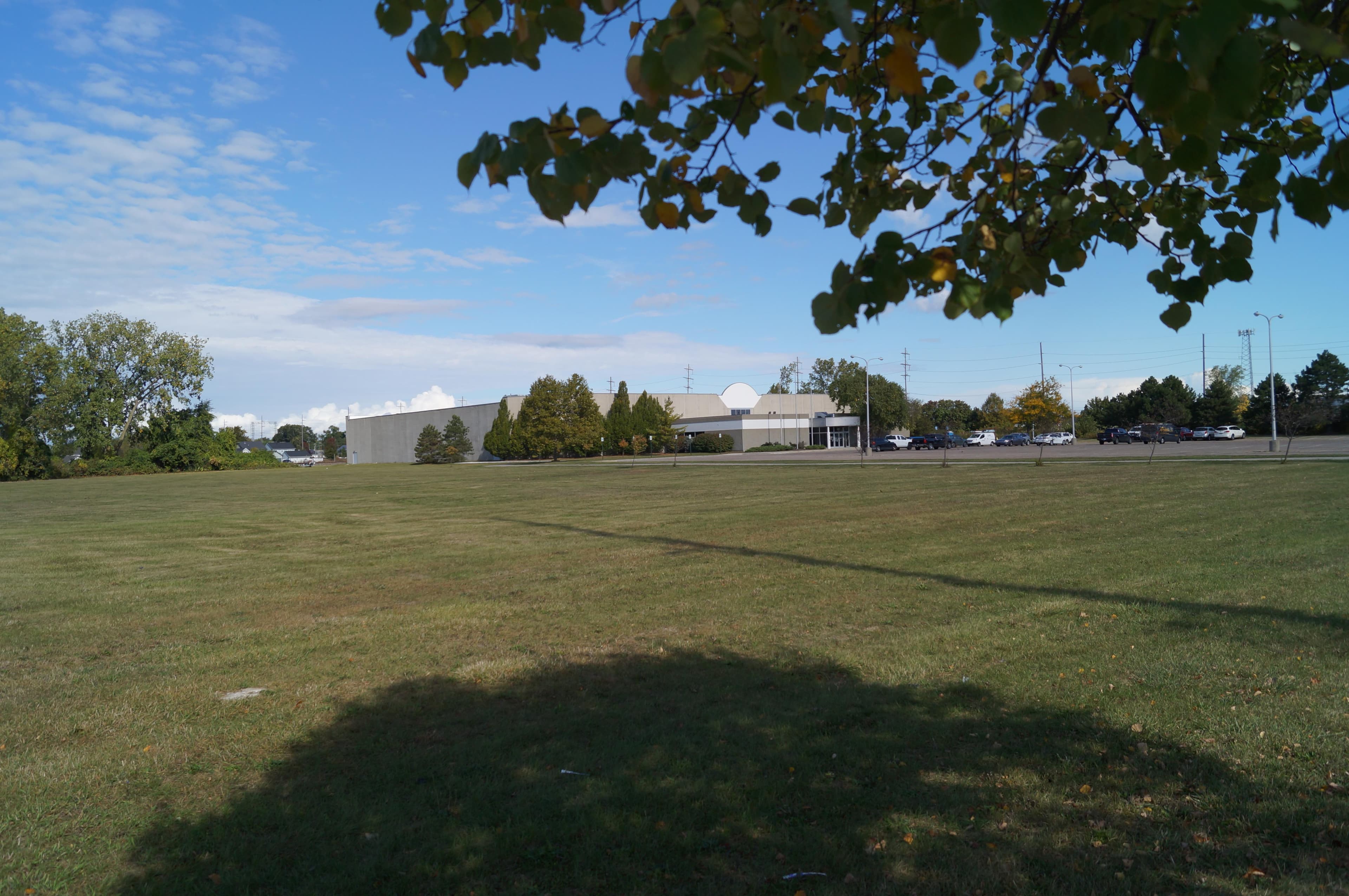 Side lawn with education center building in the background