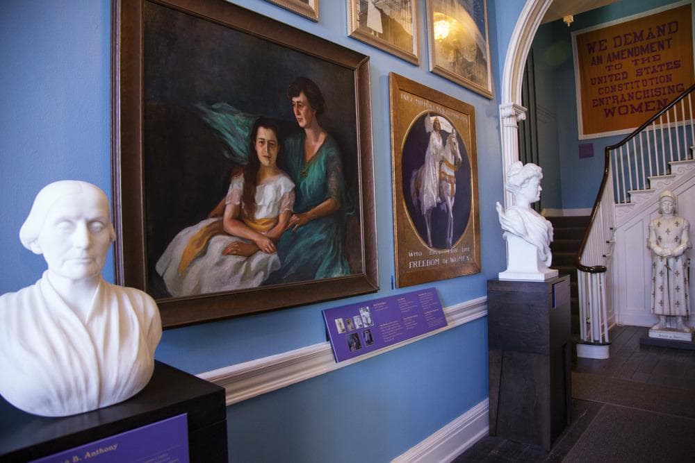 Belmont-Paul entrance hall with marble busts on pedestals in front of paintings on walls