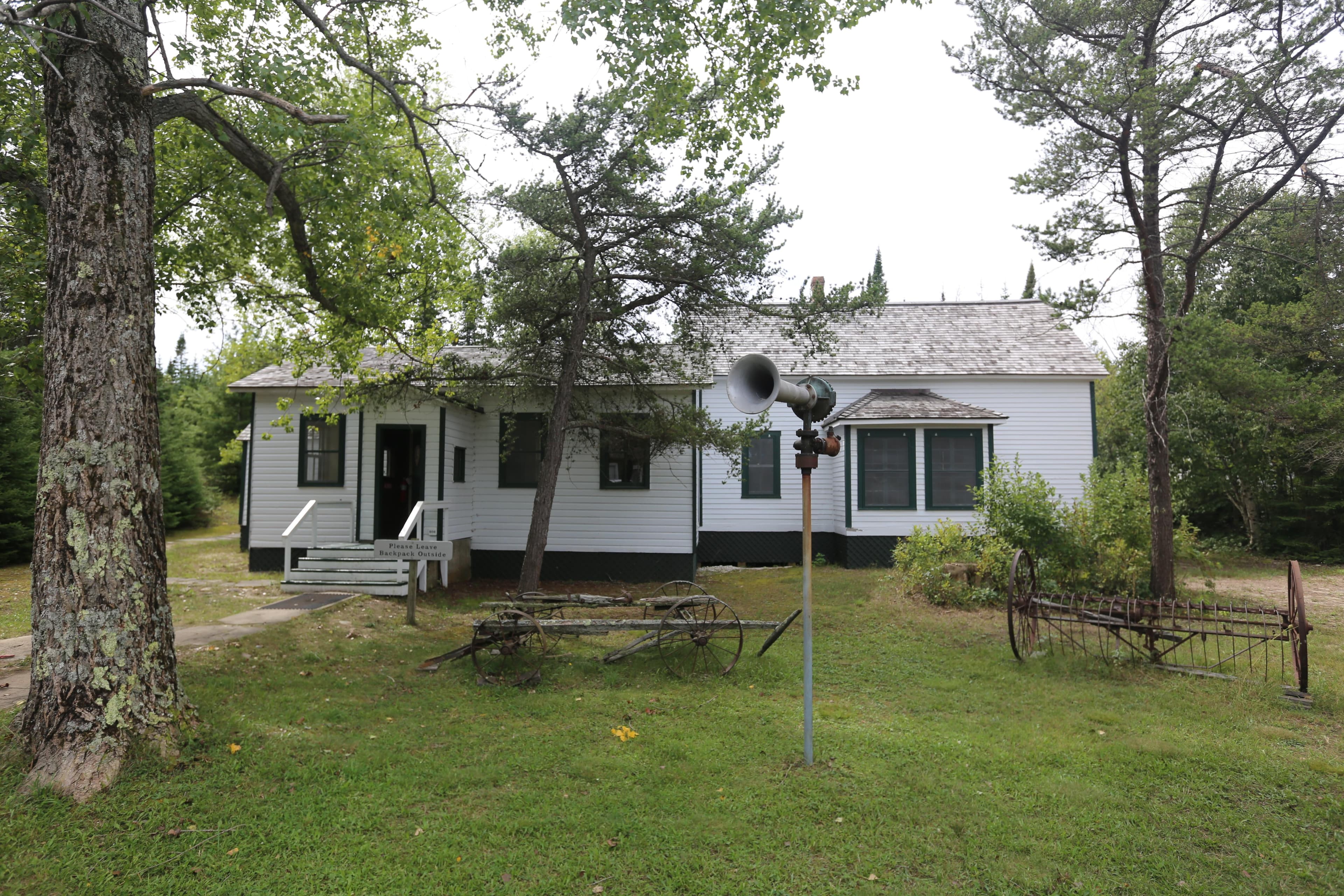 The island visitor center, a one-story clapboard building with several black-shingled gable roofs
