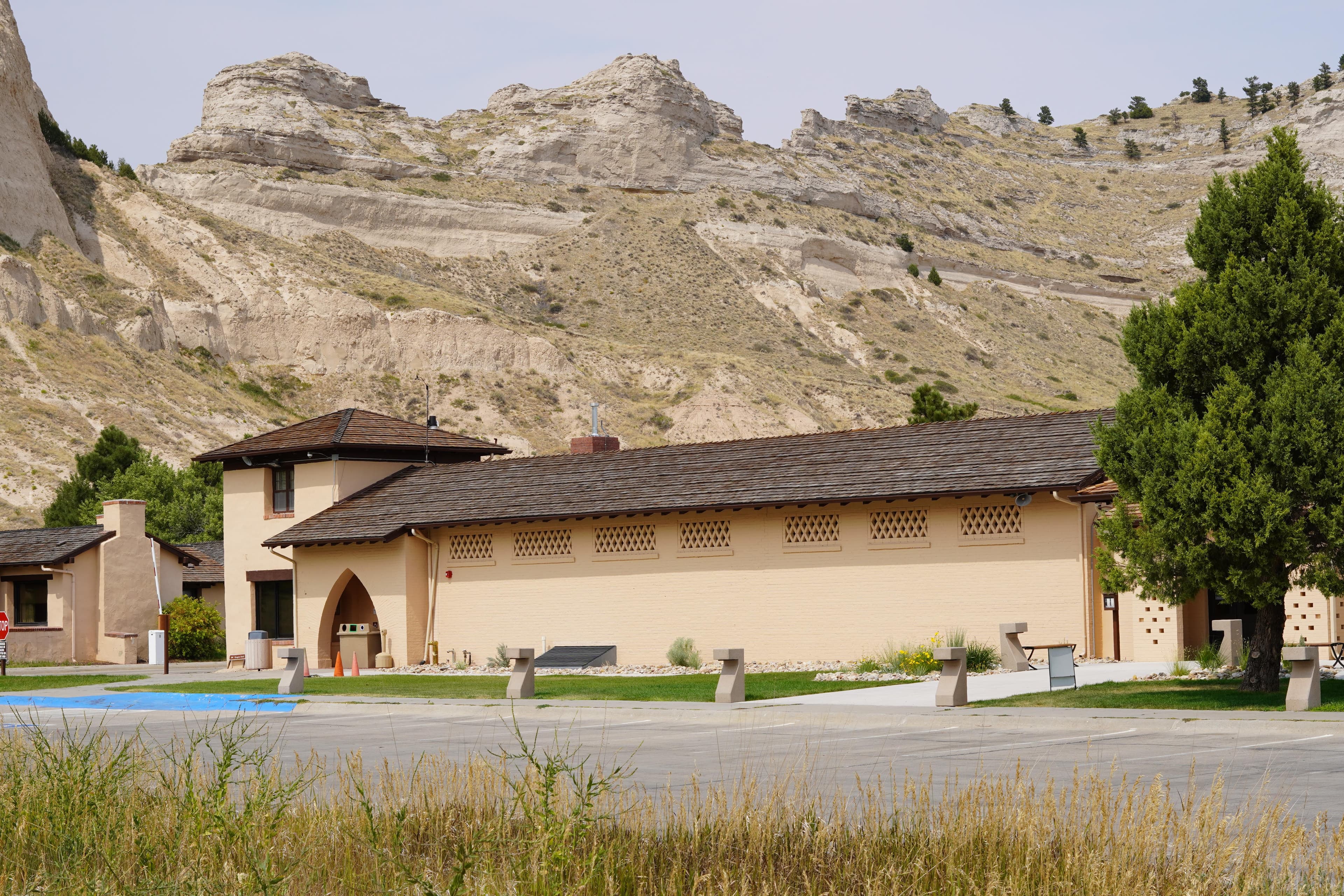 The Scotts Bluff Visitor Center and dramatic sandstone rock formations in the background.
