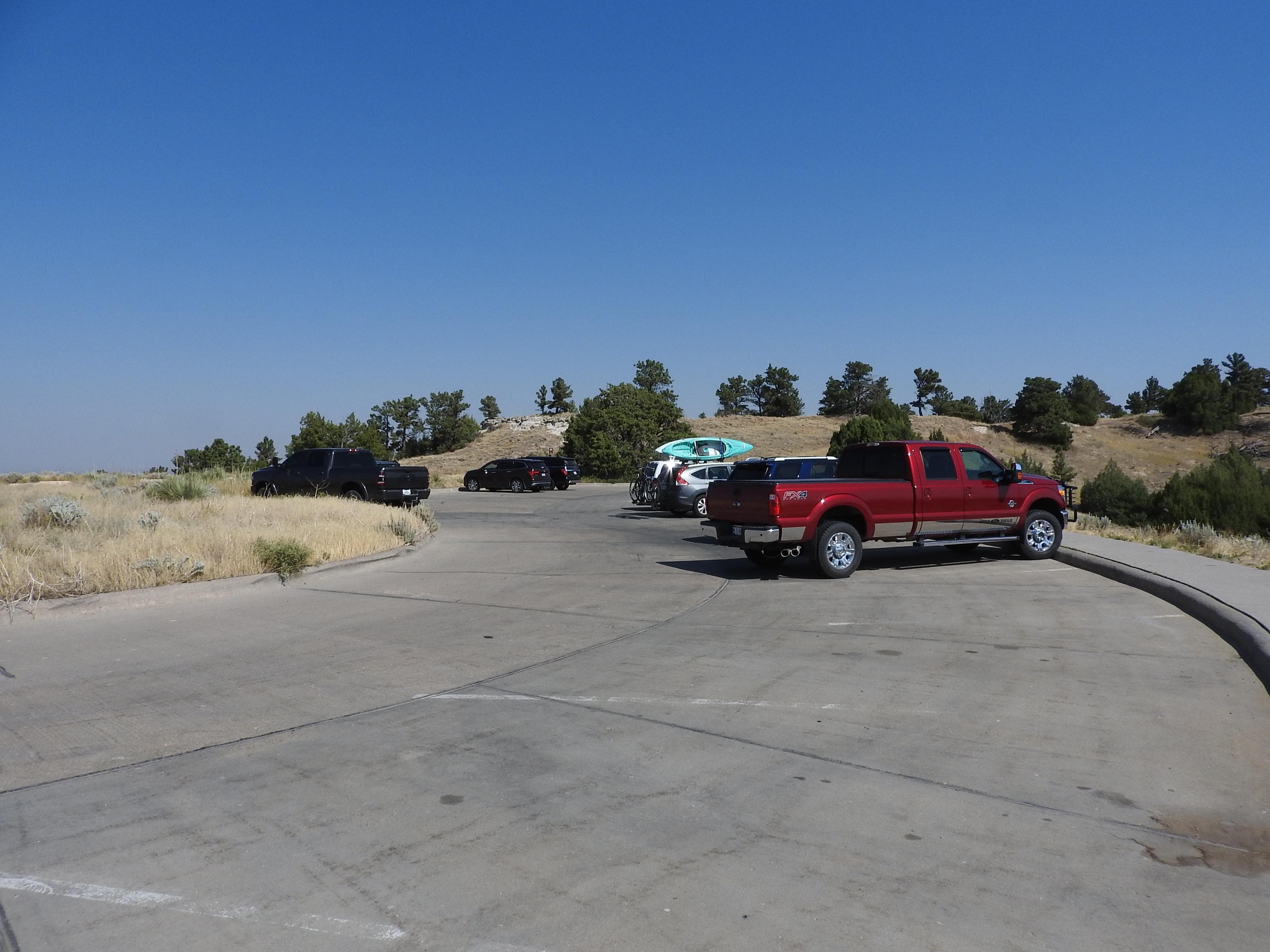 Cars are parked in a parking lot.