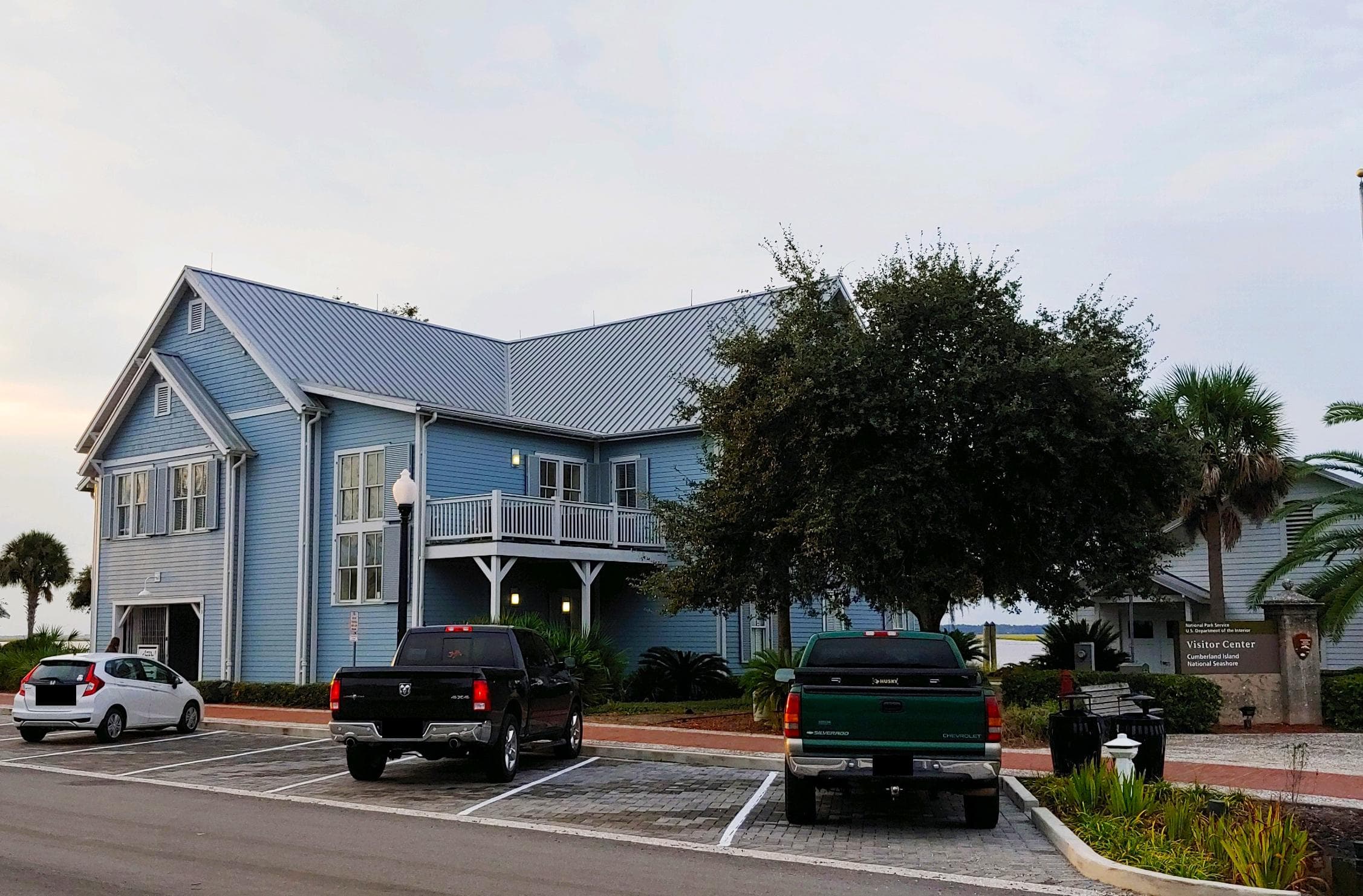A blue, two story building