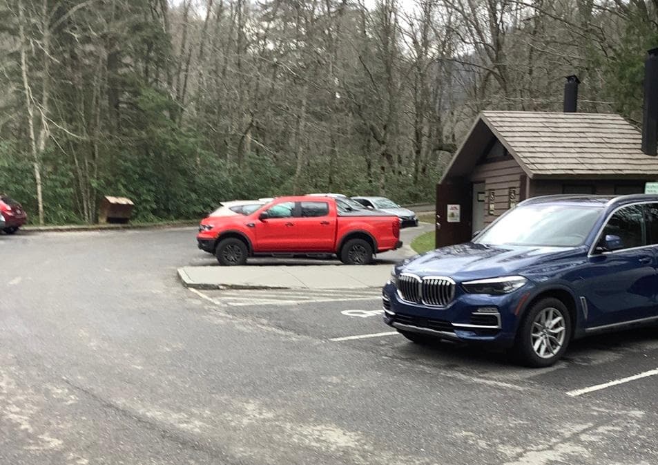 Image of vehicles parked at Alum Cave Trailhead.