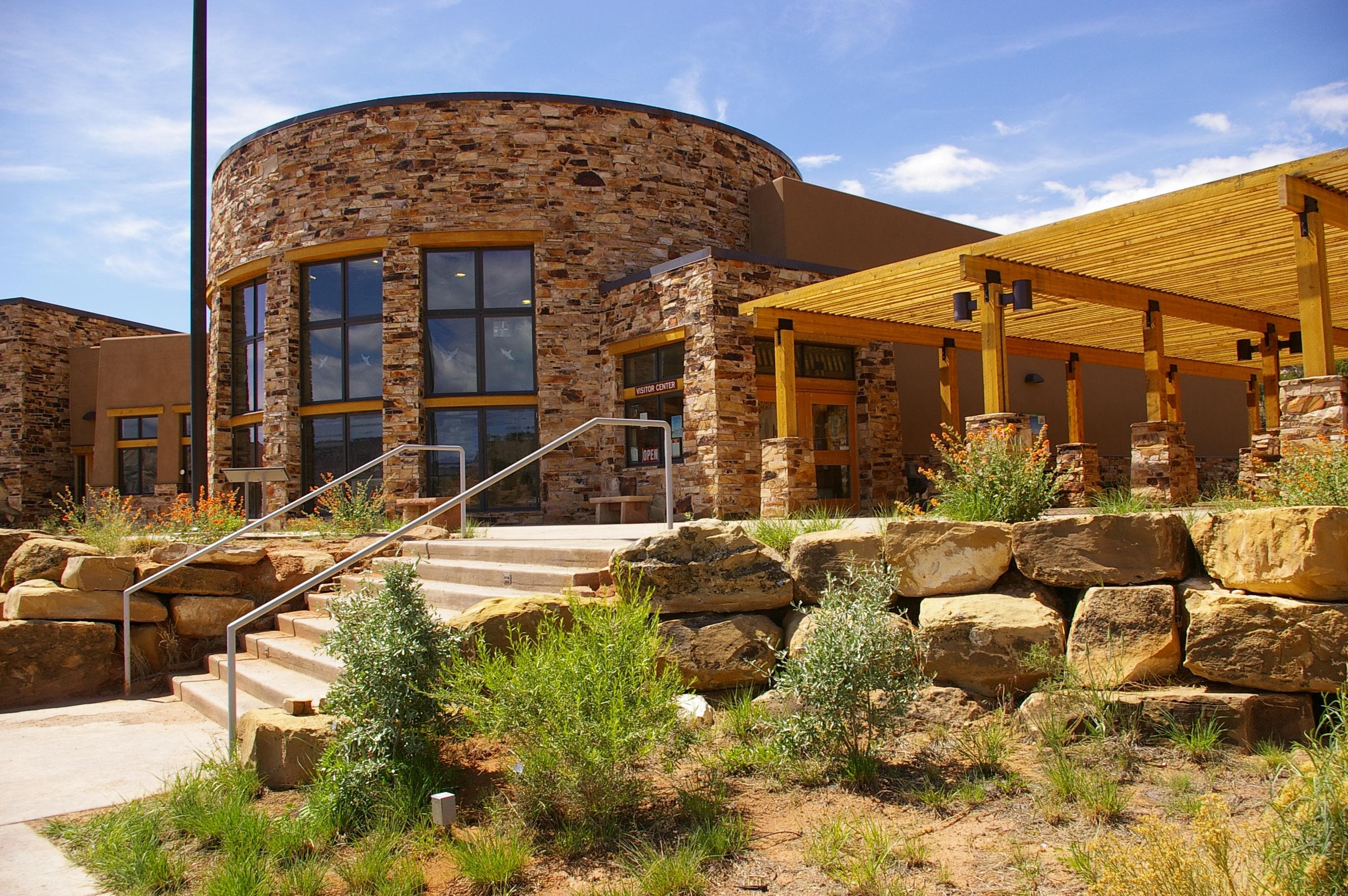 Modern building with stairs and patio.