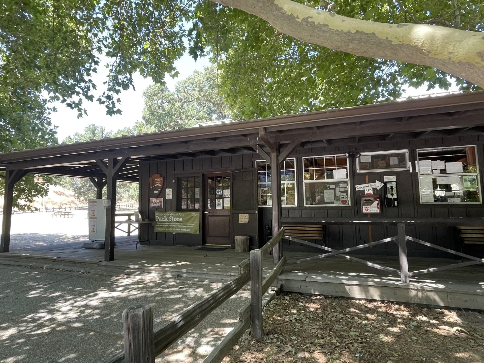 Front of a wooden building and deck of a park store front