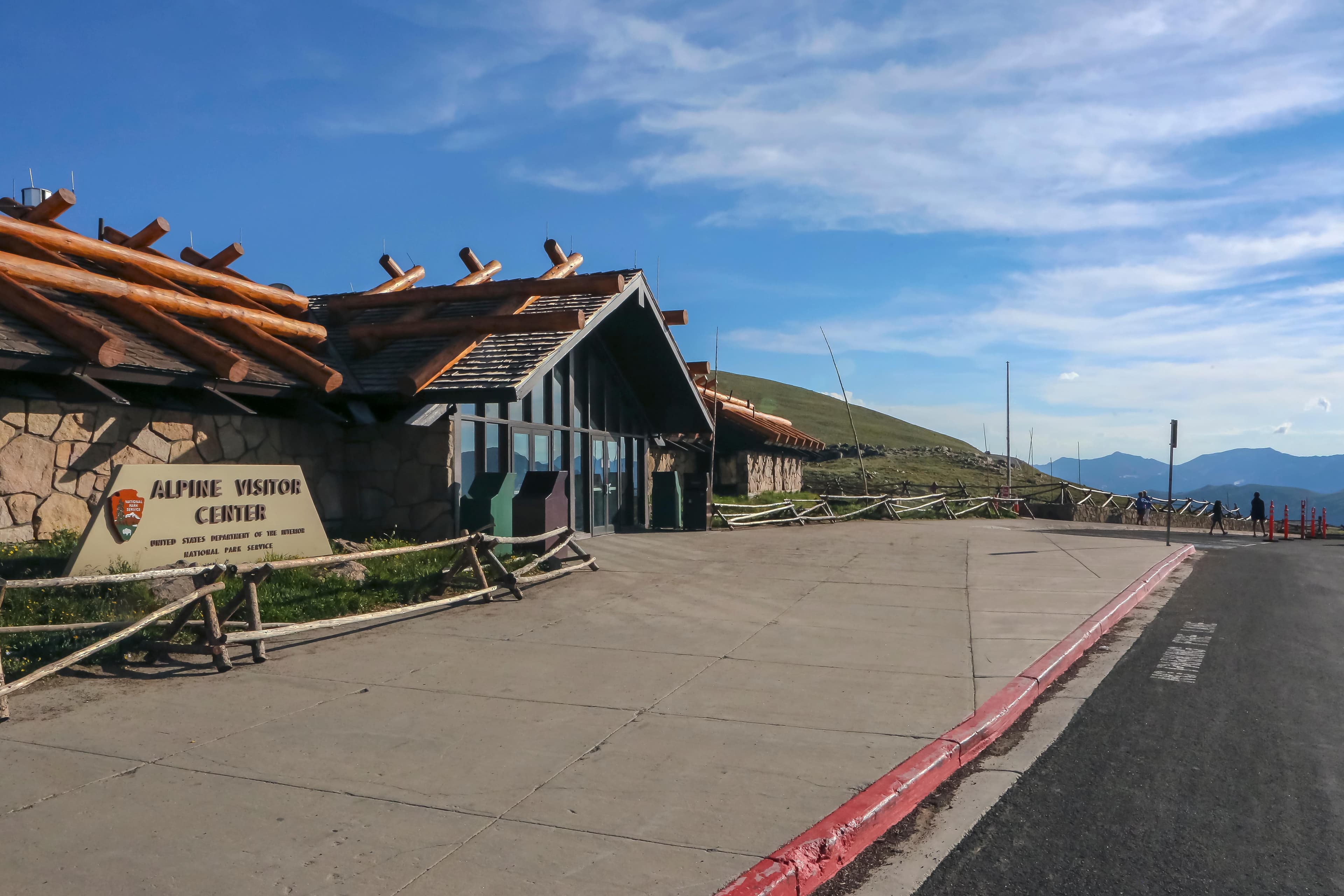 View of the Front Doors to Alpine Visitor Center on a clear, sunny day in summer