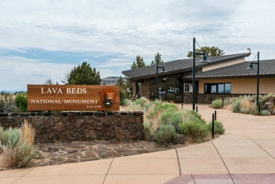 Curved walk way leading up the entrance of the Lava Beds Visitor Center.