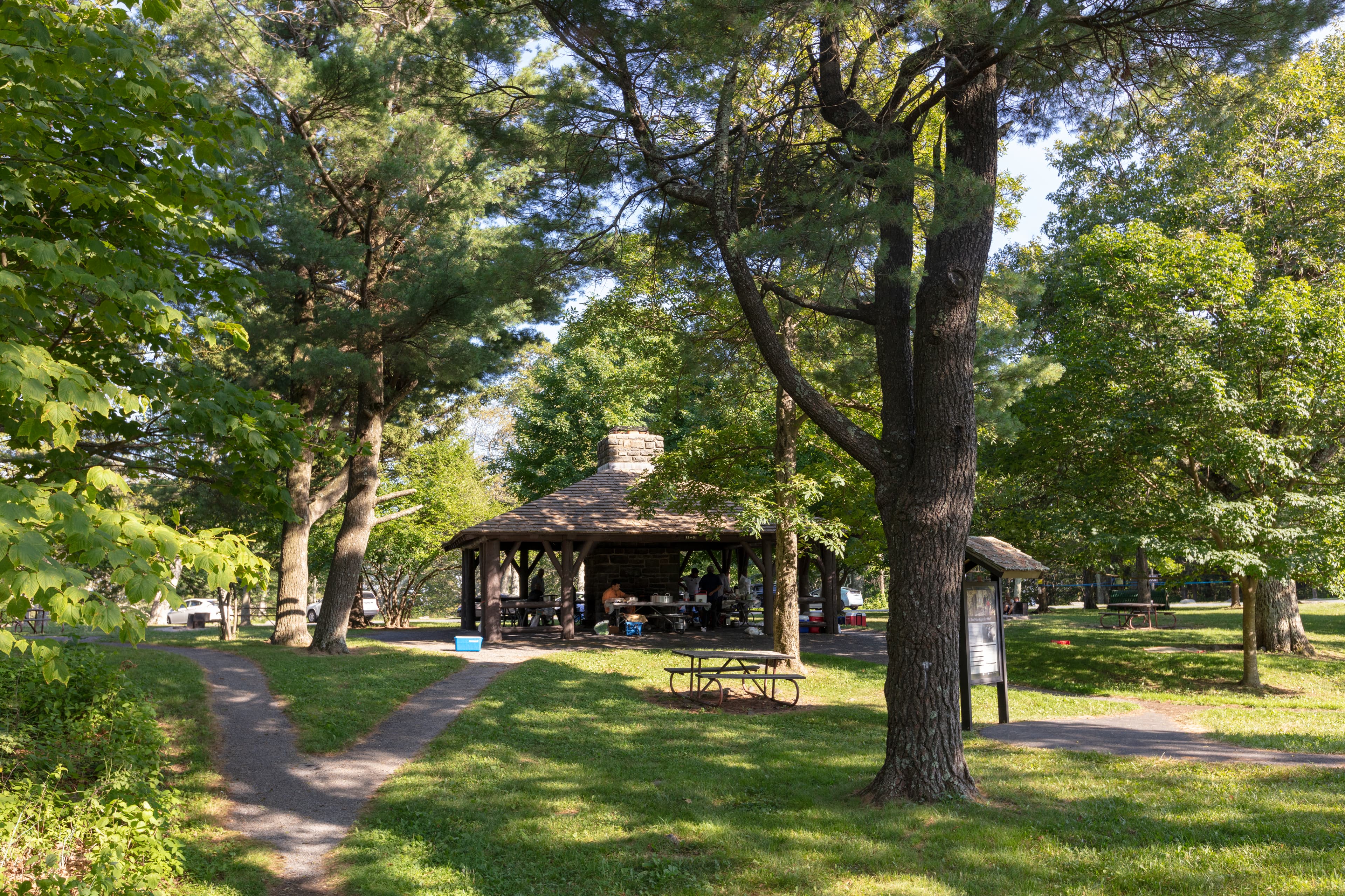 Visitors having a gathering at shelter at Pinnacles Picnic Grounds.